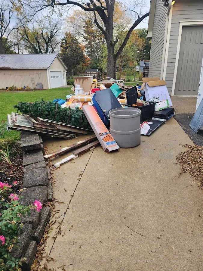 Dumpster being loaded with debris for 10 Yard Dumpster Rental in Blacksburg